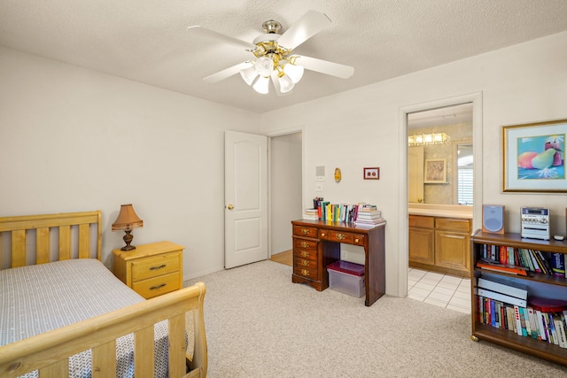6574 Eagle Ridge Dr, El Paso, TX 79912 - bedroom with light colored carpet, ensuite bathroom, ceiling fan, and a textured ceiling
