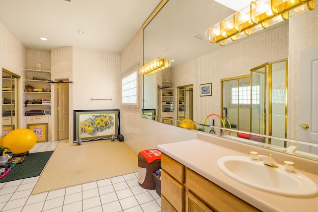 6574 Eagle Ridge Dr, El Paso, TX 79912 - full bath featuring wallpapered walls, vanity, a shower stall, and tile patterned floors