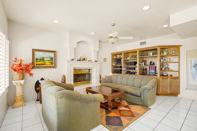6574 Eagle Ridge Dr, El Paso, TX 79912 - living area with light tile patterned floors, a ceiling fan, recessed lighting, and a tiled fireplace