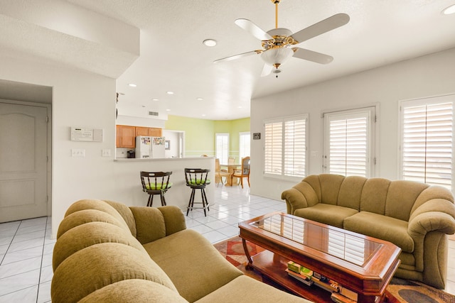 6574 Eagle Ridge Dr, El Paso, TX 79912 - living room with light tile patterned floors, recessed lighting, and ceiling fan