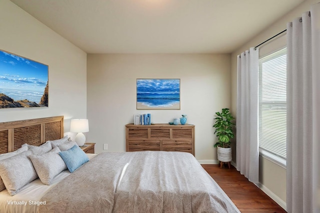 722 Horseshoe Springs Ln, Houston, TX 77090 - bedroom with wood finished floors and baseboards
