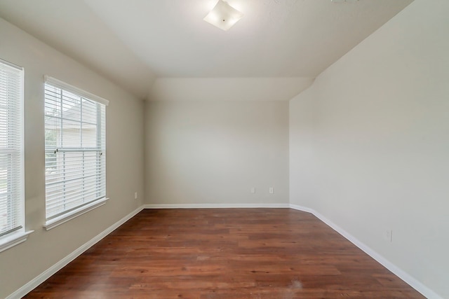 722 Horseshoe Springs Ln, Houston, TX 77090 - empty room with wood finished floors, vaulted ceiling, and baseboards