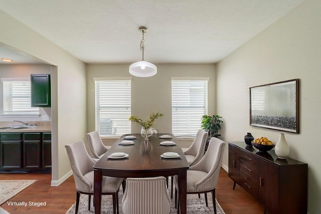 722 Horseshoe Springs Ln, Houston, TX 77090 - dining area featuring dark wood-style flooring and baseboards
