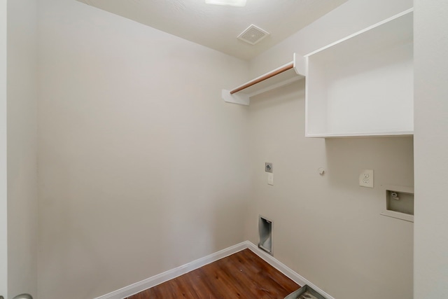 722 Horseshoe Springs Ln, Houston, TX 77090 - laundry area with hookup for an electric dryer, dark wood-style floors, gas dryer hookup, baseboards, and washer hookup