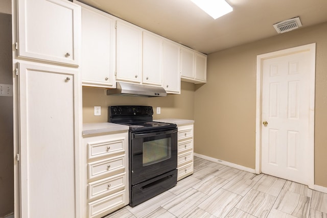 4111 Brown St, Bacliff, TX 77518 - kitchen featuring black range with electric stovetop, under cabinet range hood, light countertops, white cabinetry, and baseboards
