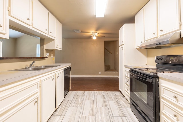 4111 Brown St, Bacliff, TX 77518 - kitchen featuring black appliances, under cabinet range hood, a sink, a ceiling fan, and light countertops