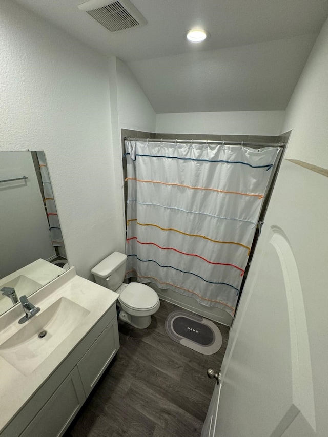 10026 Rose Mallow Ln, Magnolia, TX 77354 - bathroom featuring vanity, vaulted ceiling, toilet, wood finished floors, and a shower with curtain