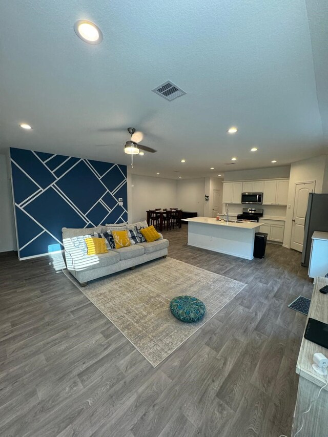 10026 Rose Mallow Ln, Magnolia, TX 77354 - living room with dark wood-style flooring, recessed lighting, and ceiling fan