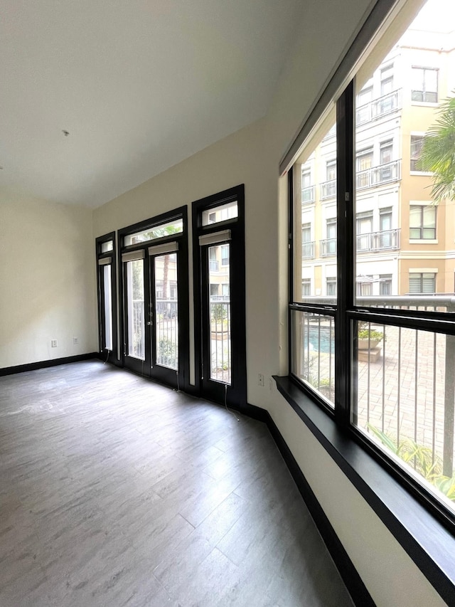 1901 Post Oak Blvd Unit 1213, Houston, TX 77056 - unfurnished room featuring wood finished floors and baseboards