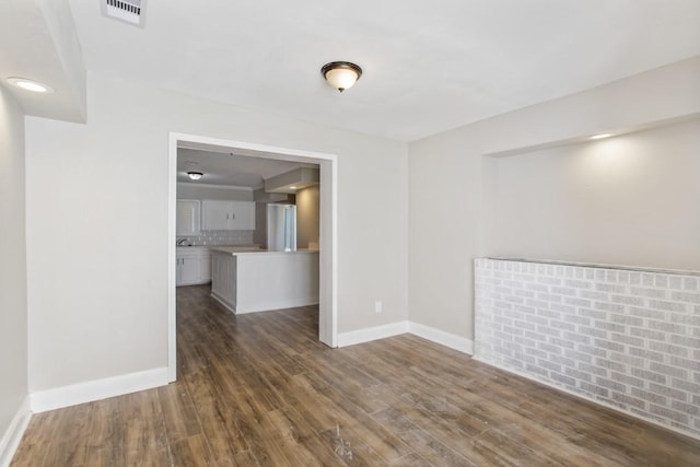 208 Preston St, La Marque, TX 77568 - unfurnished room with baseboards and wood finished floors