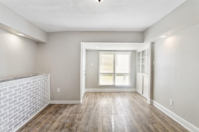 208 Preston St, La Marque, TX 77568 - unfurnished room with wood finished floors and baseboards