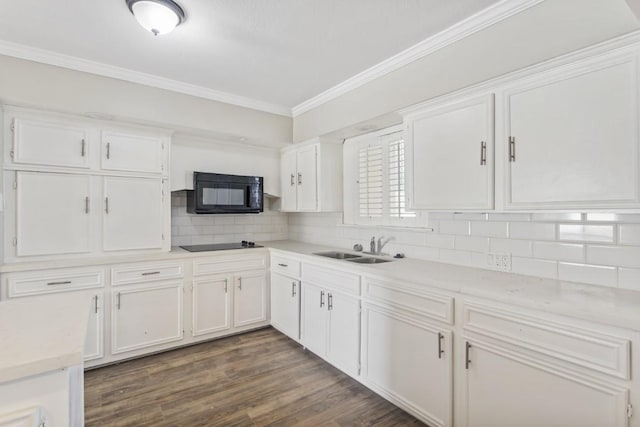 208 Preston St, La Marque, TX 77568 - kitchen with black appliances, a sink, crown molding, white cabinetry, and decorative backsplash