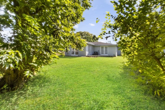 208 Preston St, La Marque, TX 77568 - view of green lawn featuring french doors