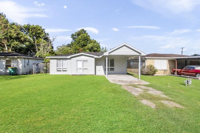208 Preston St, La Marque, TX 77568 - view of front facade with a front lawn, driveway, and an attached carport