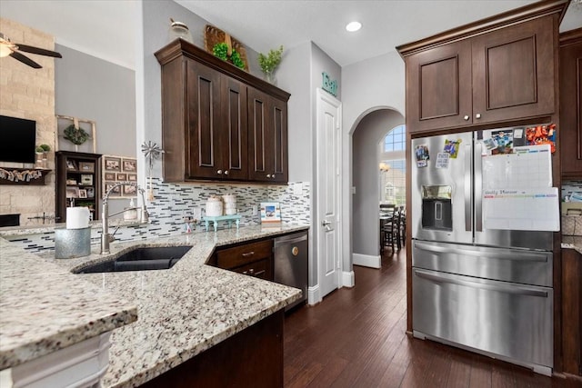 231 N Waterstone Dr, Montgomery, TX 77356 - kitchen featuring appliances with stainless steel finishes, arched walkways, ceiling fan, decorative backsplash, and recessed lighting