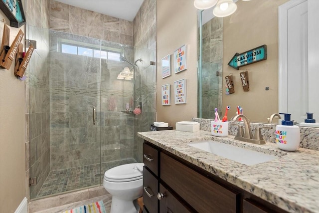 231 N Waterstone Dr, Montgomery, TX 77356 - bathroom with vanity, toilet, and a stall shower