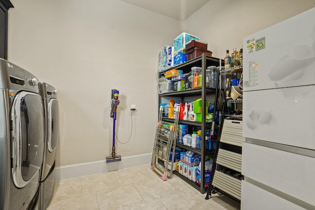 9810 Mount Whitney, Missouri City, TX 77459 - washroom featuring washer and clothes dryer and tile patterned flooring