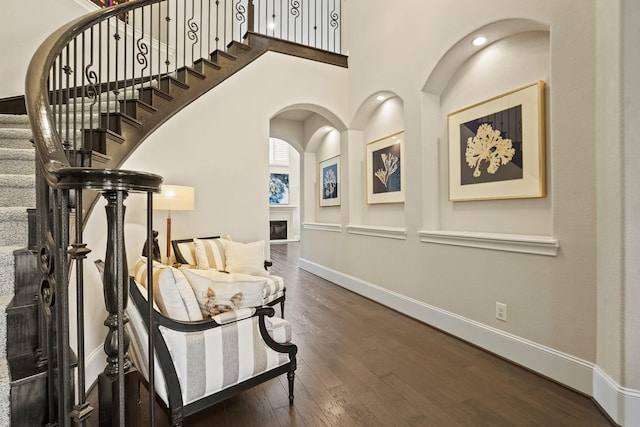 9810 Mount Whitney, Missouri City, TX 77459 - entrance foyer with wood finished floors, a fireplace, baseboards, stairs, and a high ceiling