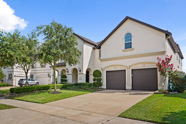 9810 Mount Whitney, Missouri City, TX 77459 - french country style house featuring a front lawn, stucco siding, driveway, and an attached garage