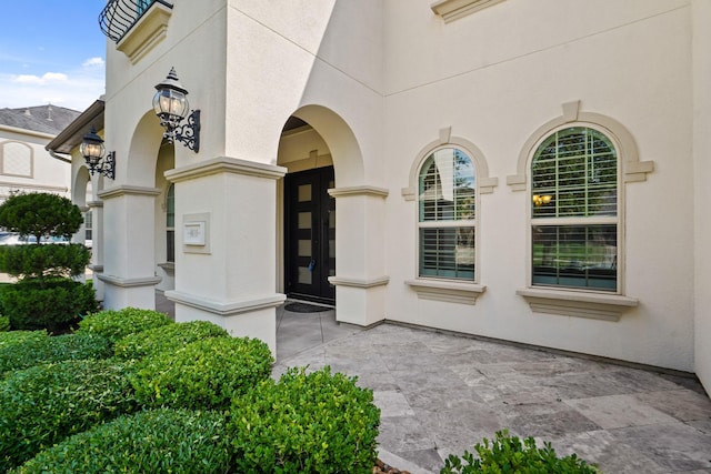 9810 Mount Whitney, Missouri City, TX 77459 - property entrance featuring stucco siding and a patio