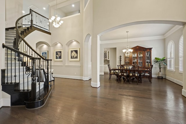 9810 Mount Whitney, Missouri City, TX 77459 - foyer with a chandelier, dark wood-style flooring, baseboards, stairway, and crown molding