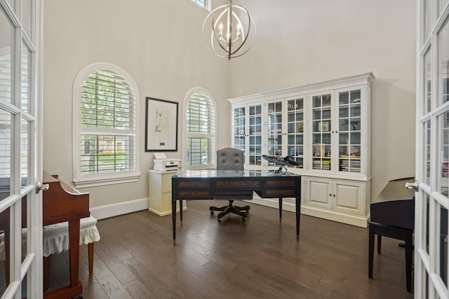 9810 Mount Whitney, Missouri City, TX 77459 - home office with plenty of natural light, dark wood-type flooring, french doors, a chandelier, and a towering ceiling