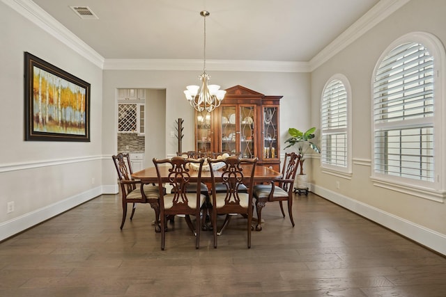 9810 Mount Whitney, Missouri City, TX 77459 - dining room featuring a chandelier, dark wood-type flooring, ornamental molding, and baseboards
