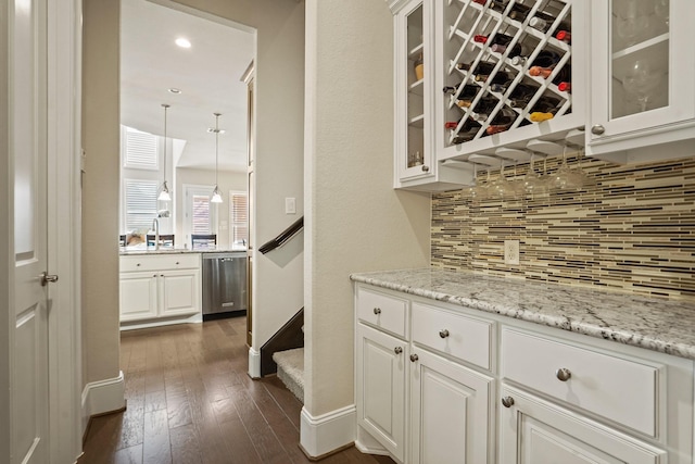 9810 Mount Whitney, Missouri City, TX 77459 - bar area featuring dishwasher, decorative backsplash, baseboards, dark wood-style floors, and recessed lighting