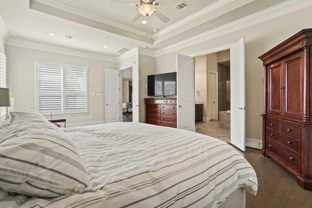9810 Mount Whitney, Missouri City, TX 77459 - bedroom featuring dark wood-style floors, a raised ceiling, baseboards, ornamental molding, and recessed lighting