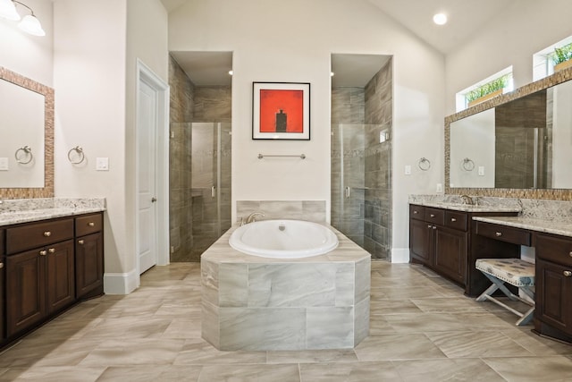9810 Mount Whitney, Missouri City, TX 77459 - full bath featuring a stall shower, two vanities, a garden tub, baseboards, and lofted ceiling