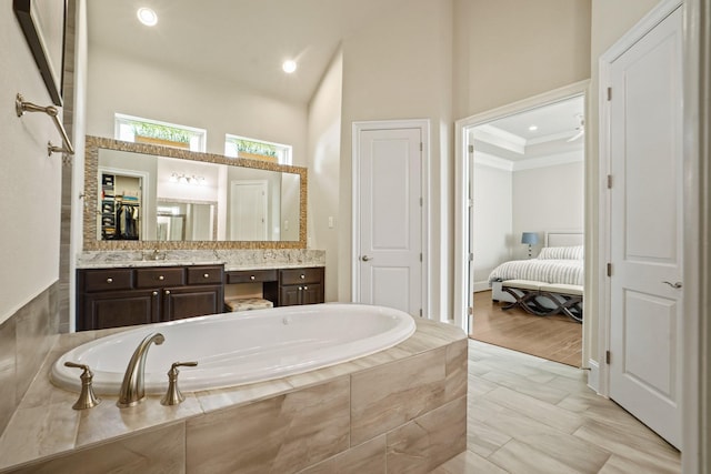 9810 Mount Whitney, Missouri City, TX 77459 - bathroom with a garden tub, vanity, recessed lighting, crown molding, and ensuite bath