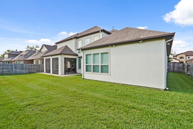 9810 Mount Whitney, Missouri City, TX 77459 - back of property featuring a sunroom, roof with shingles, and stucco siding
