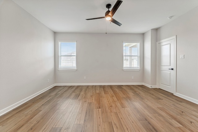 10518 Sutter Creek Dr, Iowa Colony, TX 77583 - spare room with plenty of natural light, light wood-style flooring, and a ceiling fan