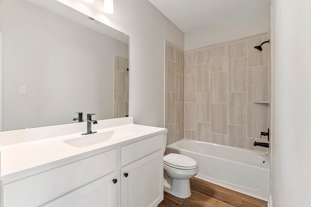 10518 Sutter Creek Dr, Iowa Colony, TX 77583 - full bath with toilet, vanity,  shower combination, and wood finished floors