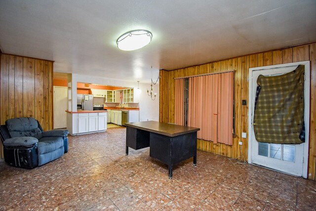 8602 Ariel St, Houston, TX 77074 - kitchen with wooden walls and appliances with stainless steel finishes