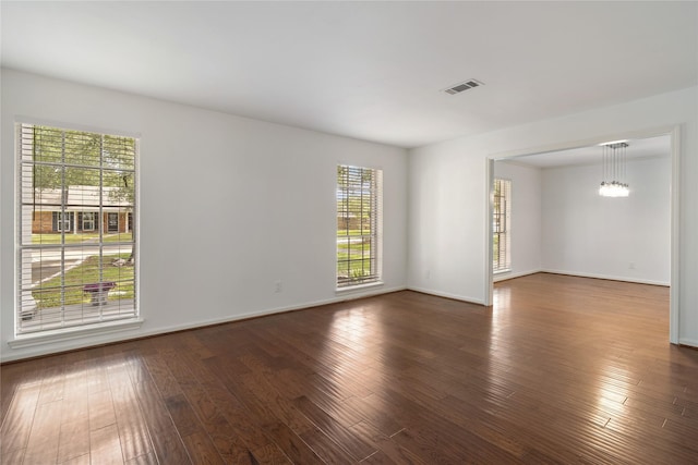 215 Whispering Oaks Dr, Taylor Lake Village, TX 77586 - empty room with dark wood finished floors and baseboards