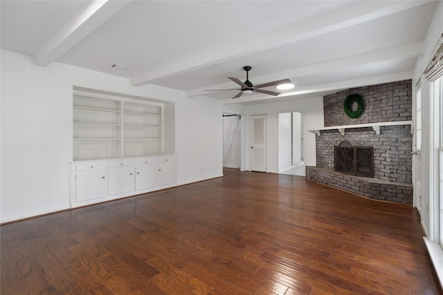 215 Whispering Oaks Dr, Taylor Lake Village, TX 77586 - unfurnished living room featuring dark wood finished floors, beam ceiling, a fireplace, and ceiling fan