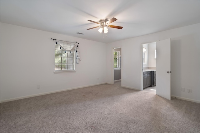 215 Whispering Oaks Dr, Taylor Lake Village, TX 77586 - unfurnished room with ceiling fan, light carpet, and baseboards