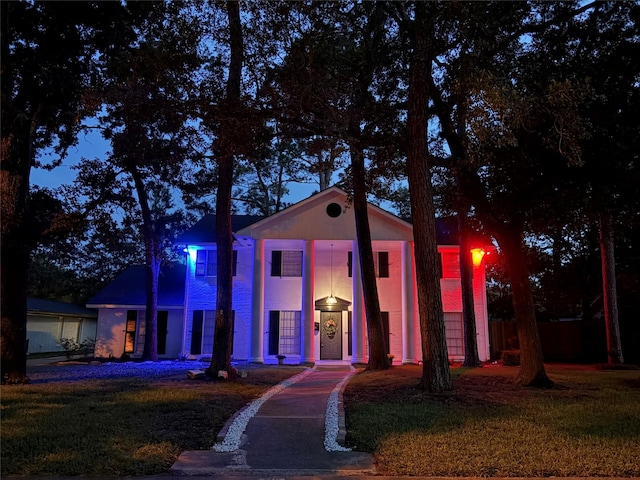 215 Whispering Oaks Dr, Taylor Lake Village, TX 77586 - greek revival inspired property featuring a front yard