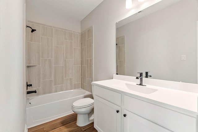 1927 June Lake Ln, Iowa Colony, TX 77583 - full bath featuring toilet, vanity, bathing tub / shower combination, and wood finished floors