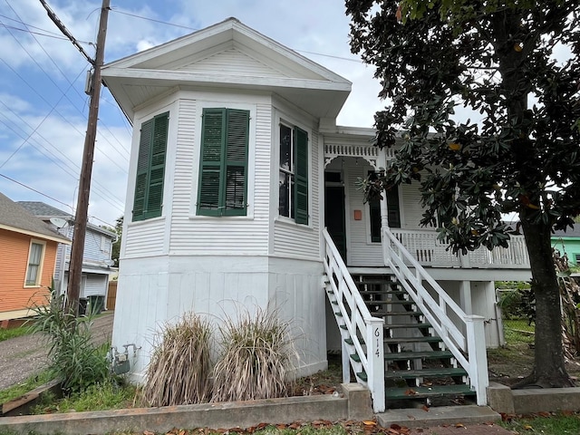 614 18th St, Galveston, TX 77550 - view of front of property featuring stairway and a porch