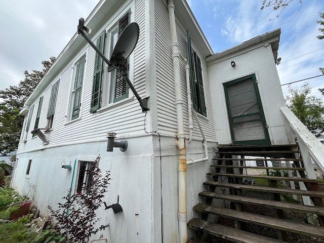 614 18th St, Galveston, TX 77550 - view of side of home featuring entry steps