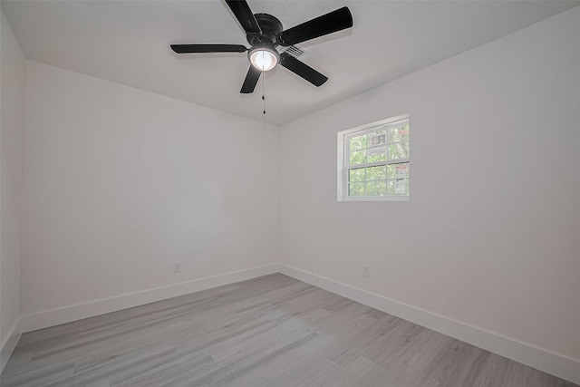15622 Corsair Rd, Houston, TX 77053 - unfurnished room with baseboards, light wood-style floors, and a ceiling fan
