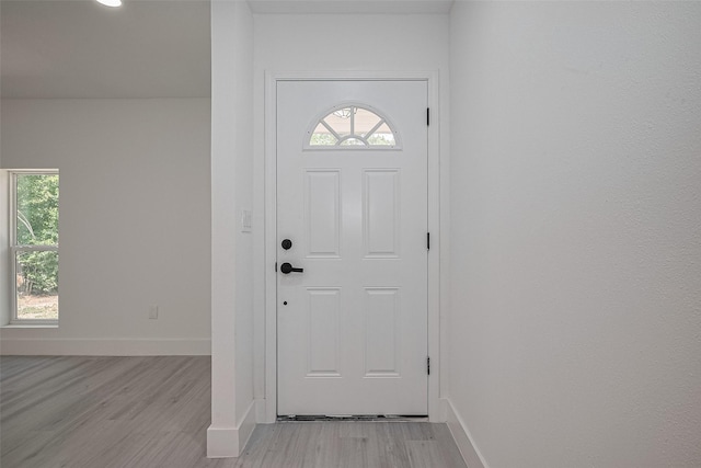 15622 Corsair Rd, Houston, TX 77053 - foyer featuring light wood-style floors, baseboards, and plenty of natural light
