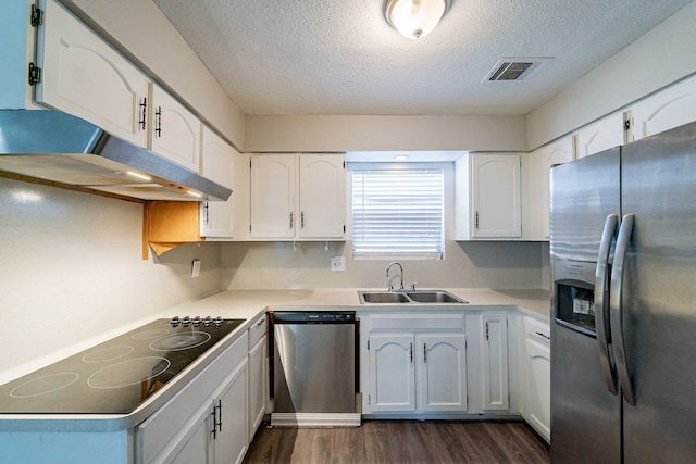 7631 Southmeadow Dr, Houston, TX 77071 - kitchen featuring appliances with stainless steel finishes, a sink, a textured ceiling, under cabinet range hood, and dark wood-style floors