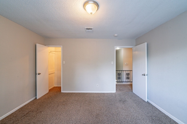 7631 Southmeadow Dr, Houston, TX 77071 - spare room with carpet flooring, baseboards, and a textured ceiling