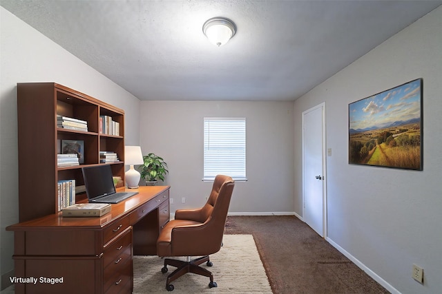 7631 Southmeadow Dr, Houston, TX 77071 - office featuring dark carpet, baseboards, and a textured ceiling