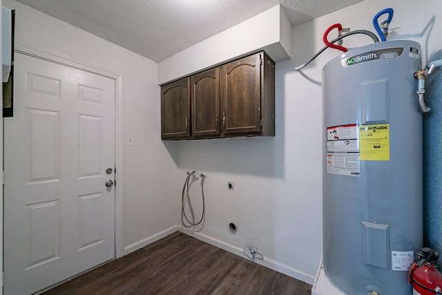 7631 Southmeadow Dr, Houston, TX 77071 - washroom featuring water heater, washer hookup, cabinet space, hookup for a gas dryer, and a textured ceiling
