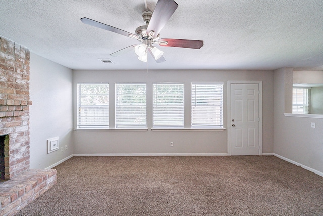 7631 Southmeadow Dr, Houston, TX 77071 - unfurnished living room featuring a ceiling fan, carpet, a textured ceiling, a fireplace, and baseboards