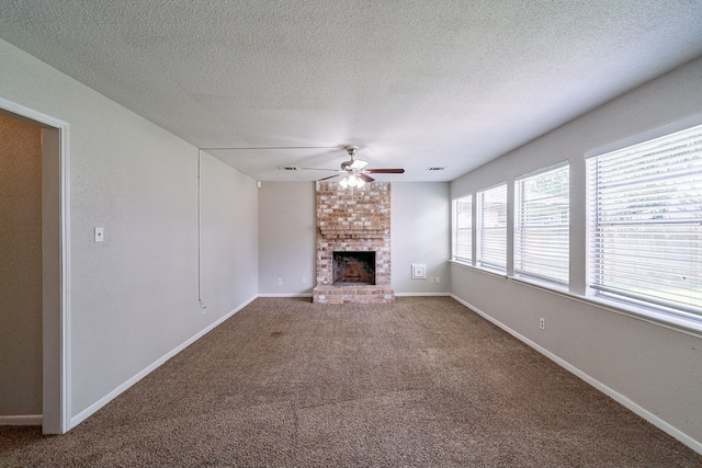 7631 Southmeadow Dr, Houston, TX 77071 - unfurnished living room featuring a ceiling fan, a brick fireplace, carpet floors, baseboards, and a textured ceiling